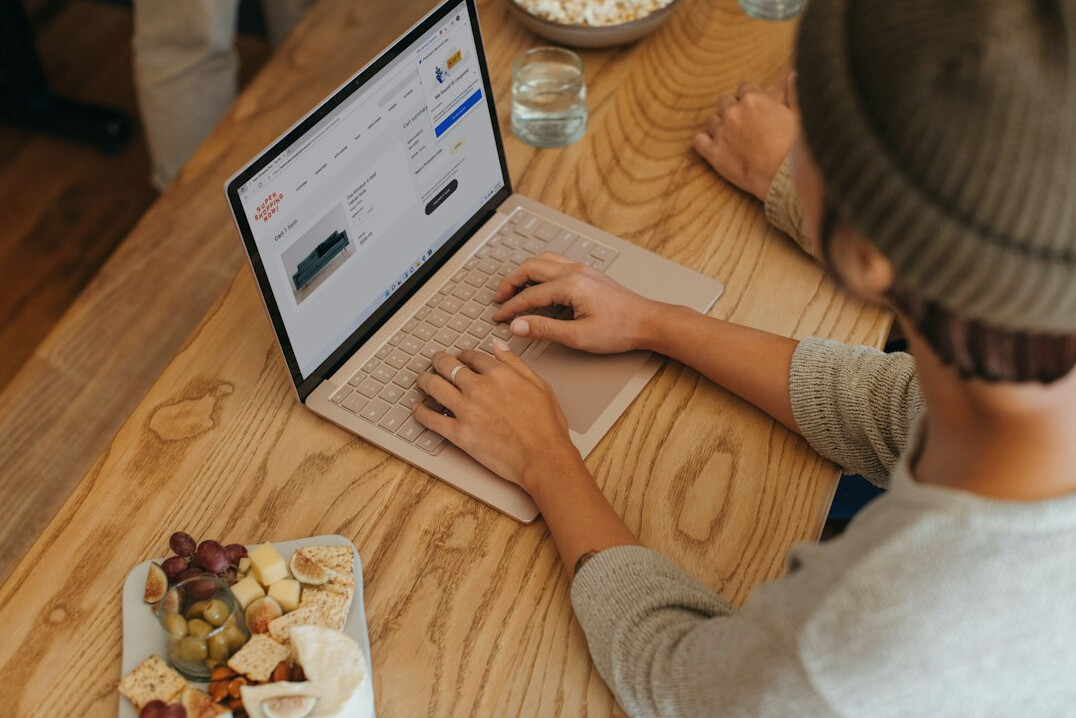 person using laptop for budgeting