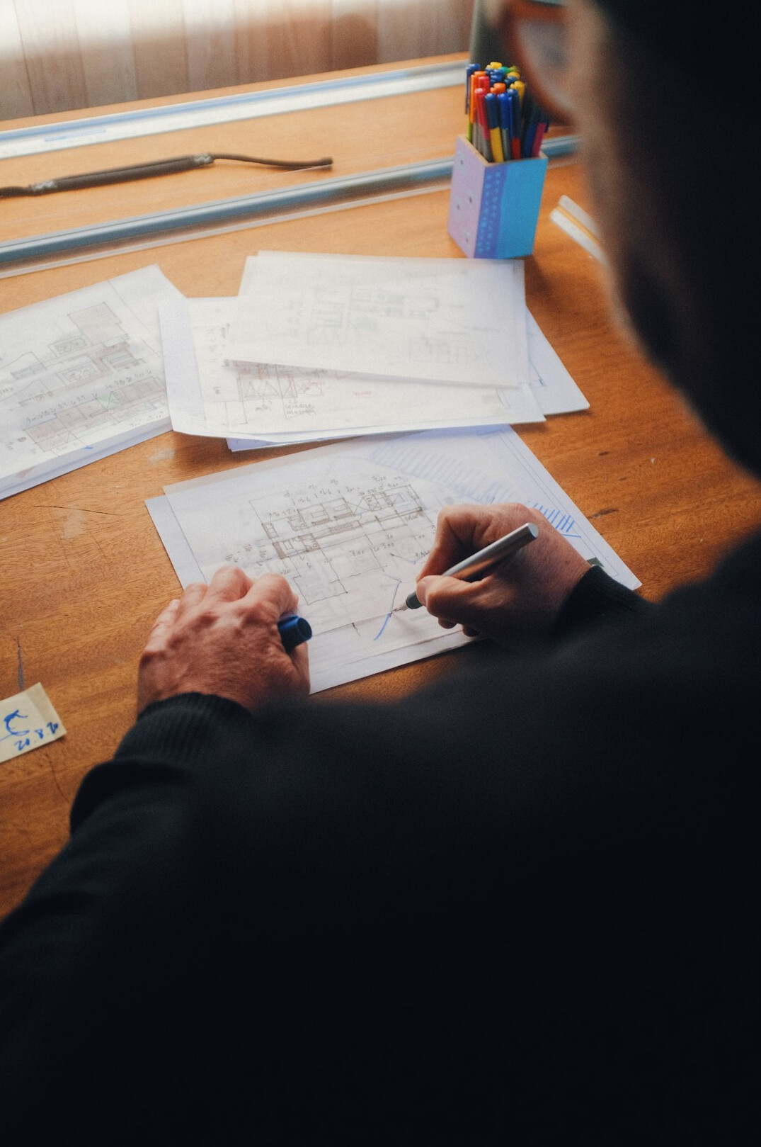person reviewing bills at desk